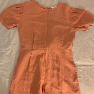 cute burnt orange romper shorts. fingertip length. with a back tie. fits perfect